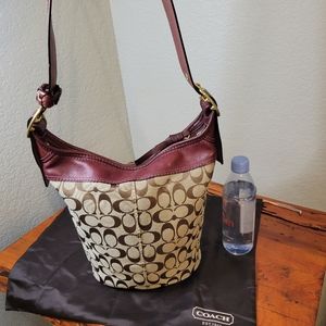 Coach bucket bag, print with maroon leather accents. Lightly used.